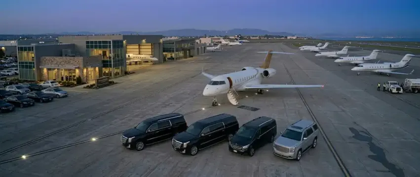 South Bay Transportation Services luxury vehicle fleet featuring black Cadillac Escalade ESVs and Mercedes Sprinter vans.